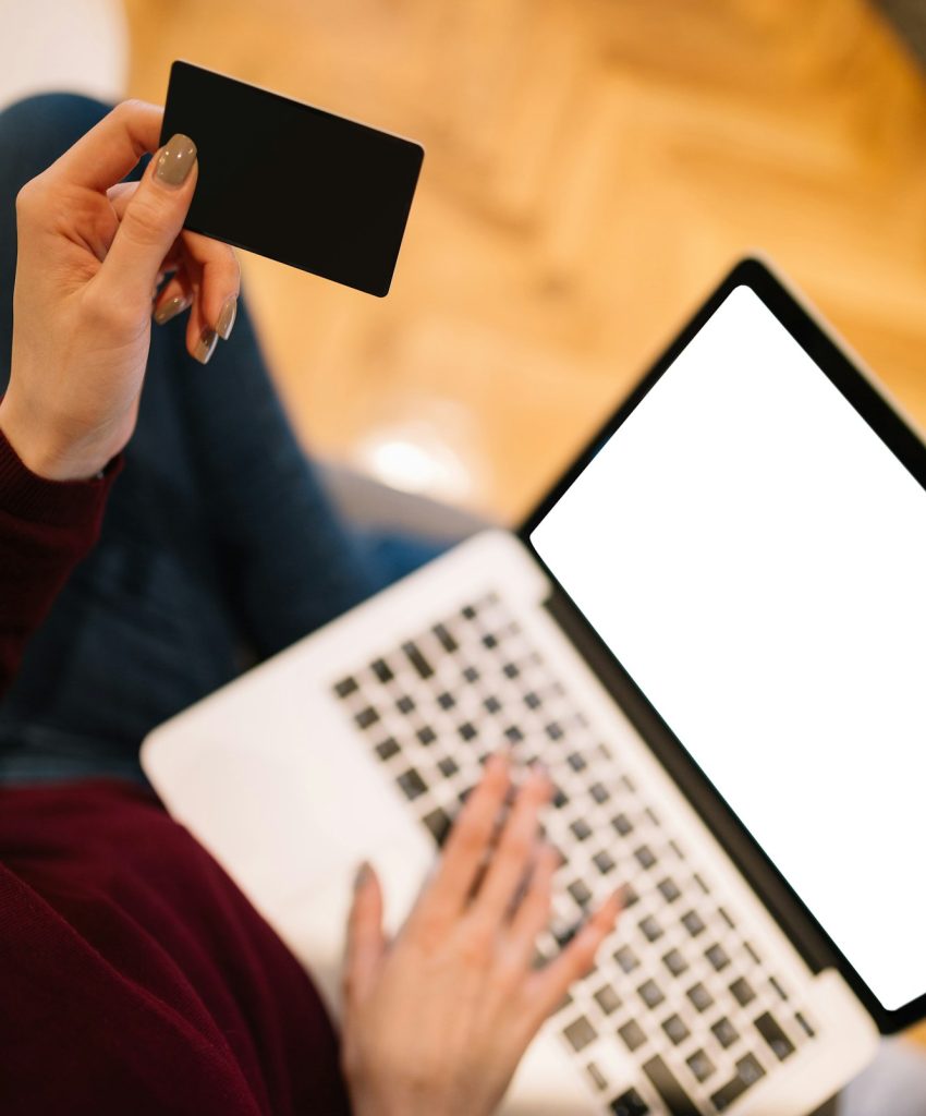 Close-up of woman hands while shopping online,